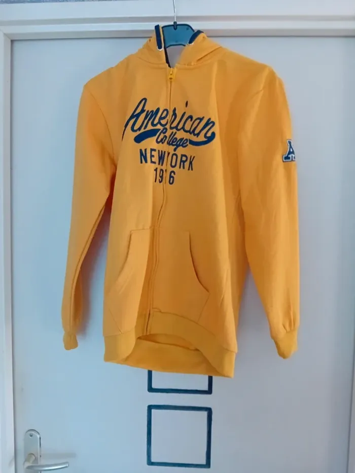 Veste jaune  taille 14 ans