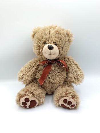 Peluche doudou ours beige marron PLANET PLUCH 25 cm assis nœud autour du cou