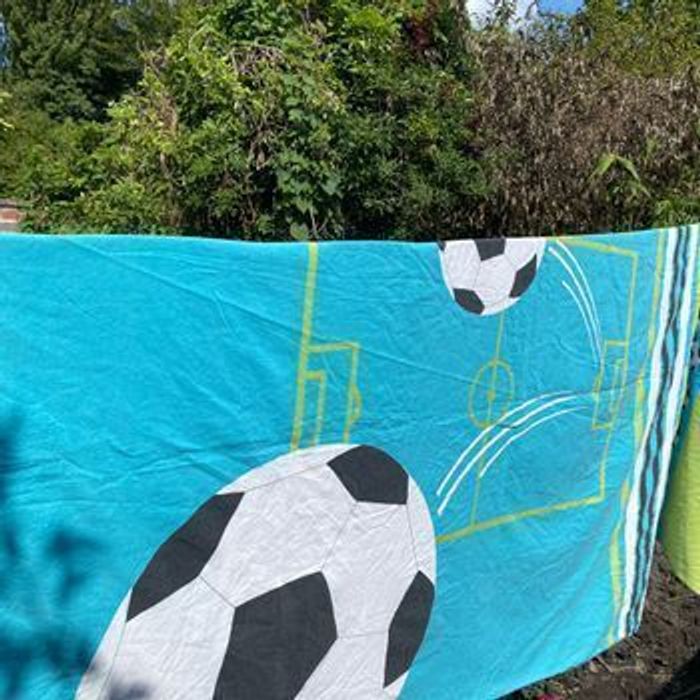 Housse de couette turquoise avec imprimé ballons de football