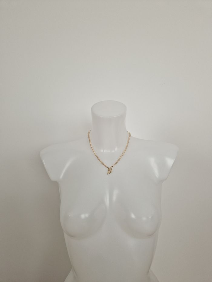 Collier perles vintage avec son motif