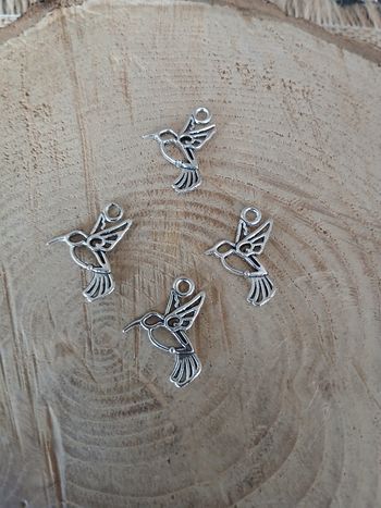 Lot de 16 pendentifs oiseaux