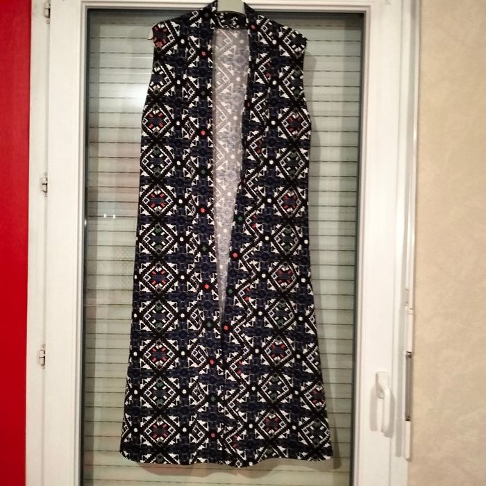 Gilet long sans manches en très bon état