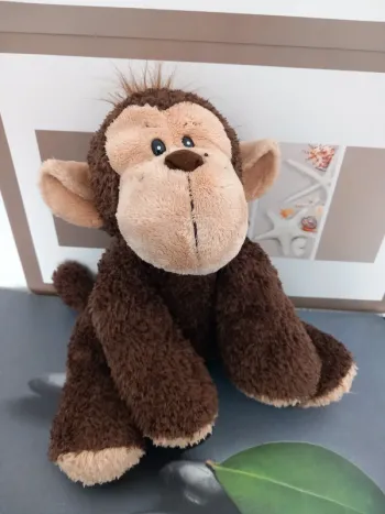 Peluche singe 33cm avec des billes à l'intérieur