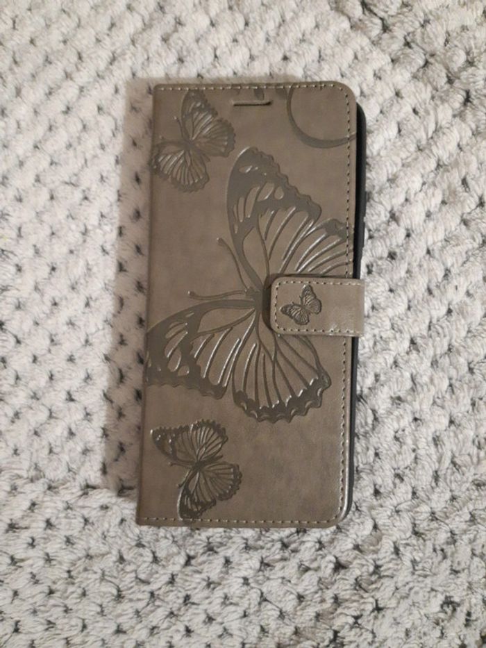 Housse de téléphone remi note 12,état neuf