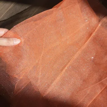 Coupon tulle orange pailleté