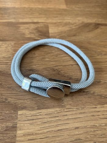 Bracelet gris et argenté neuf