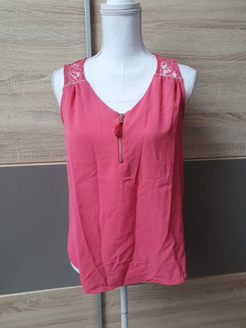 Blouse sans manches .