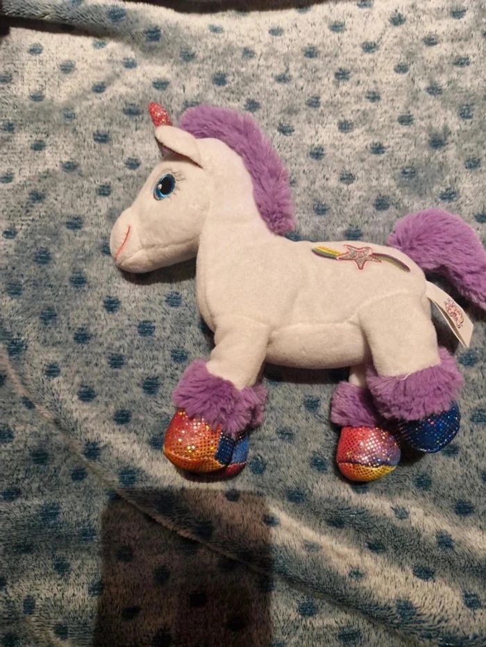 Licorne sonore blanche et violette