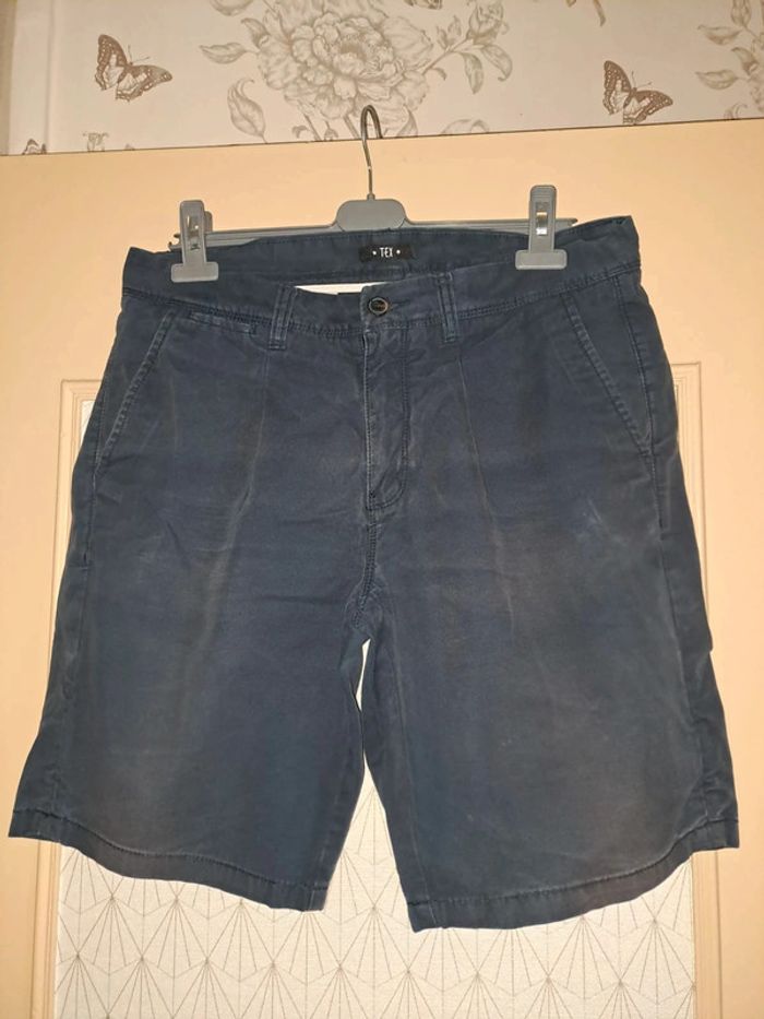Short homme tex 42 bleu légèrement décoloré