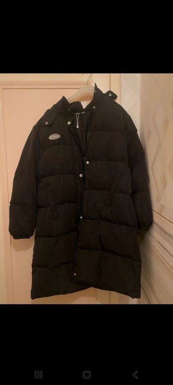 Une doudoune long noir