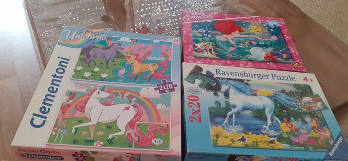 Lotde 3 boîtes de puzzles soit 5 puzzles au total