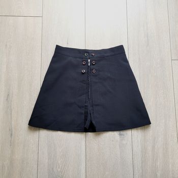 Jupe short noir en polyester. Fille 12 ans. Marque Telly