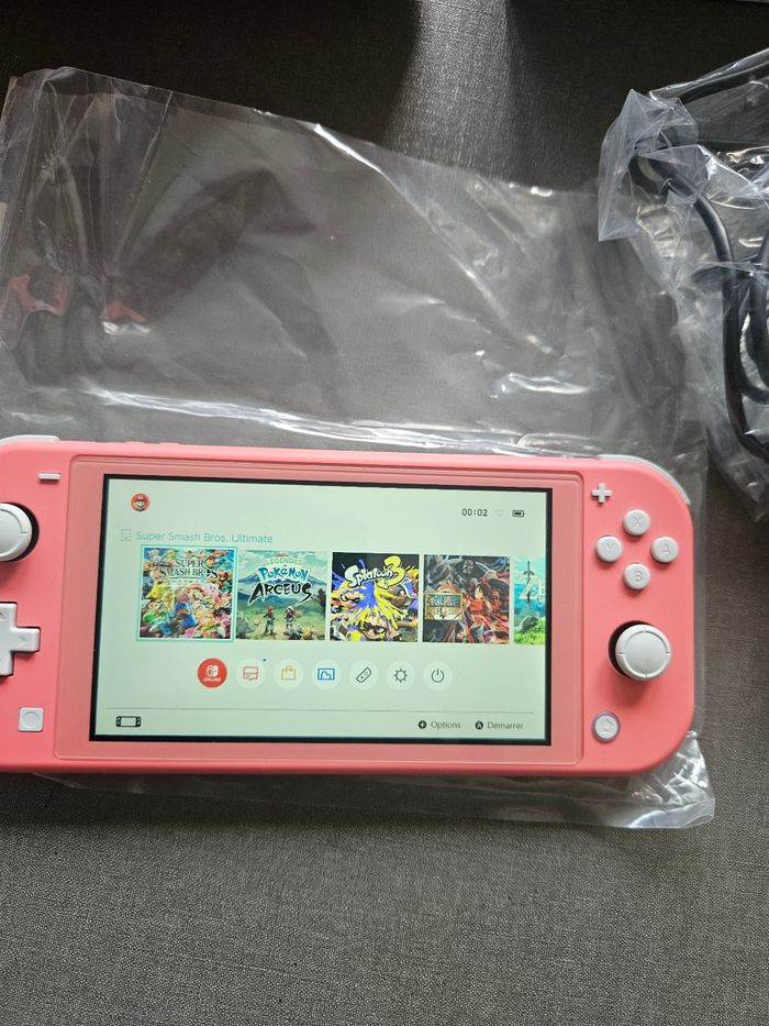Switch lite rose en parfait état - photo numéro 2