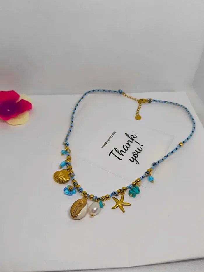 Collier doré et turquoise avec charms marins et fleur - photo numéro 3