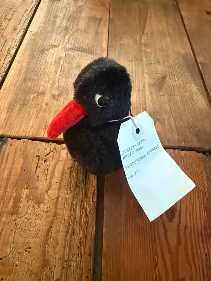 Peluche doudou Steiff oiseau corbeau noir bec rouge 10cm Hucky Rabe