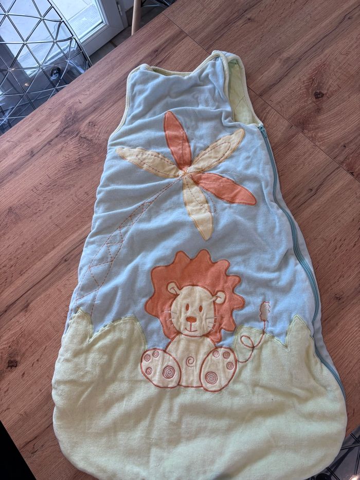 Gigoteuse bleu et jaune Lion Kitchoun 6/18 mois