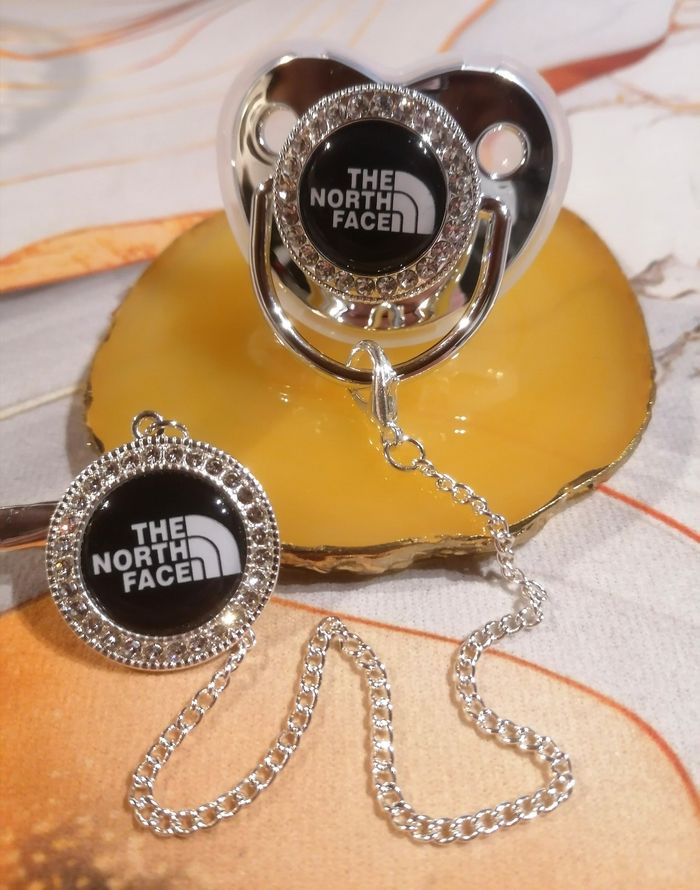 Tétine The North face argenté