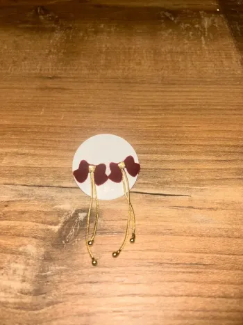 Boucles d’oreilles pendante noeud rouge