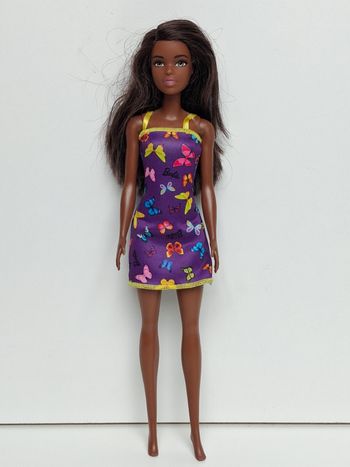 Poupée mattel Barbie Chic robe papillon mauve
Poupée et ensemble compris 