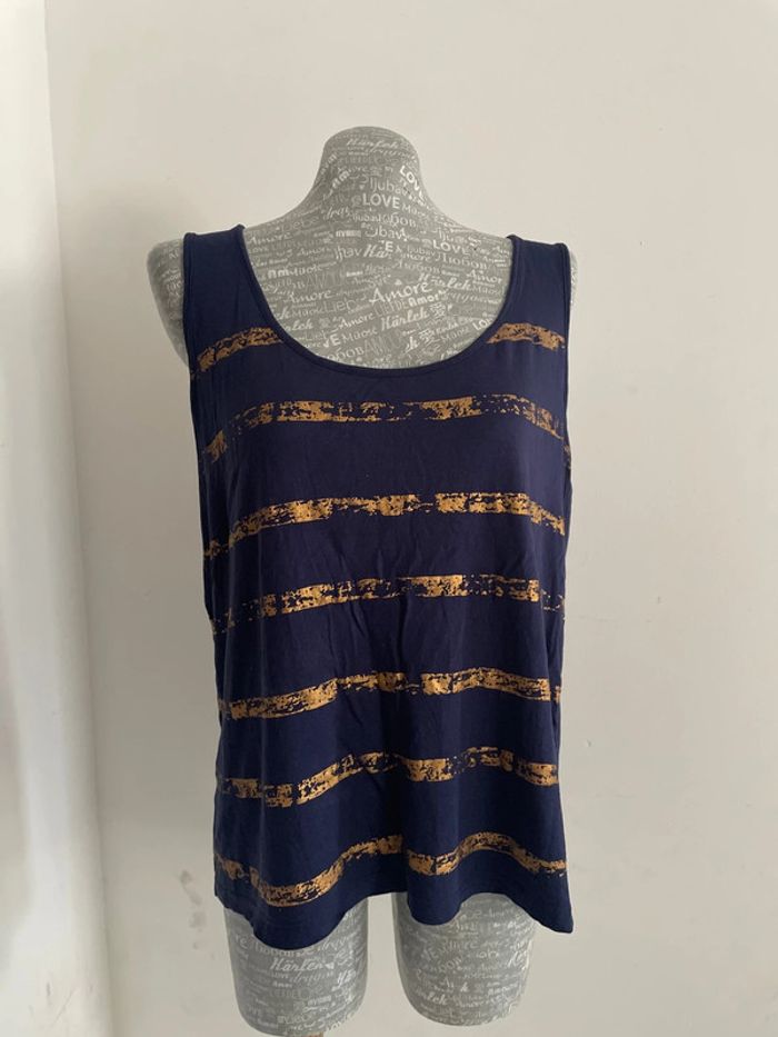 Très joli débardeur bleu marine et doré taille 40