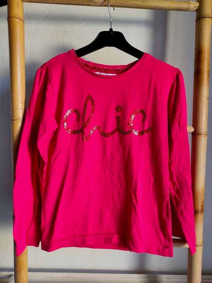 T.shirt fuchsia taille 10 ans