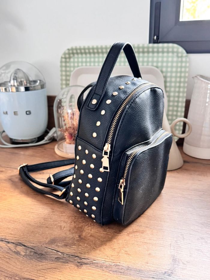 Sac à dos noir et doré - photo numéro 1