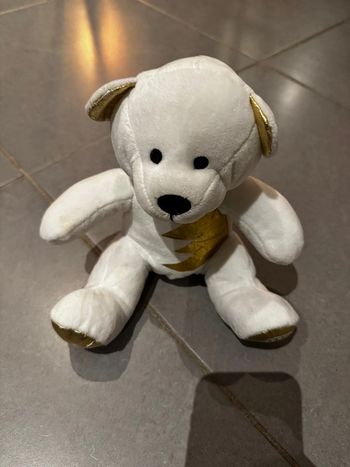 Peluche Ours - Nocibé - Certifié 100% purs câlins - Dimensions: 20 cm * 15 cm - Blanc, doré & noir