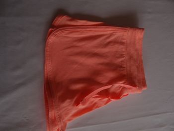 short en tissus orange fluo 8-10ans