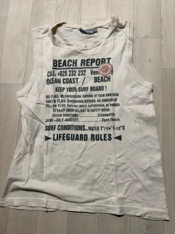 Débardeur NKY blanc 10 ans écriture devant très bon état