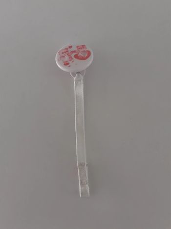 Attaché tétine