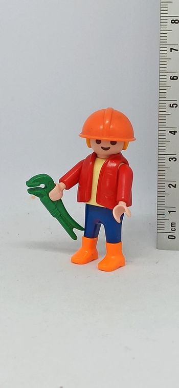 Enfant bricoleur avec casque et outil vert playmobil
