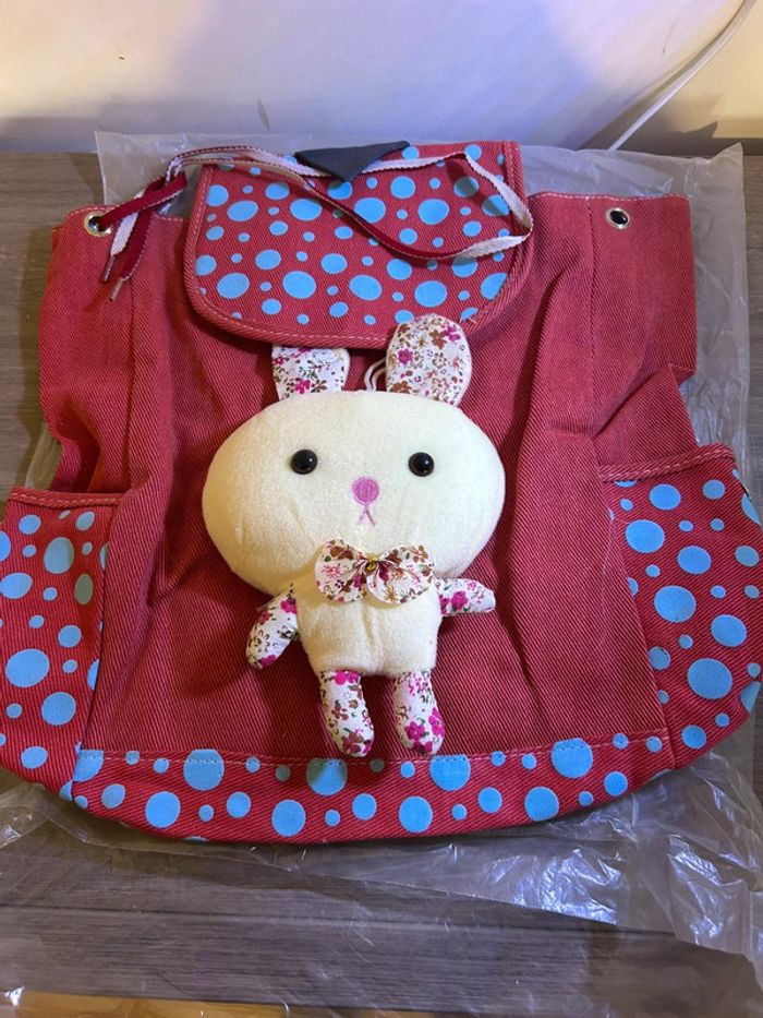 Sac à dos enfant neuf sous blister rouge avec un joli lapin