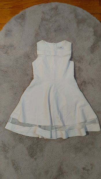 Sans manche couleur blanc cassé marque incity taille 8 ans