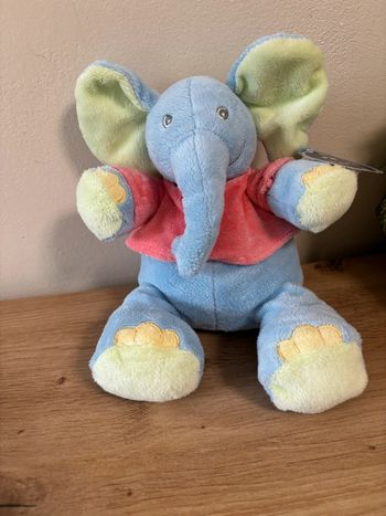 Doudou peluche éléphant bleu maillot rose musical kiabi neuf