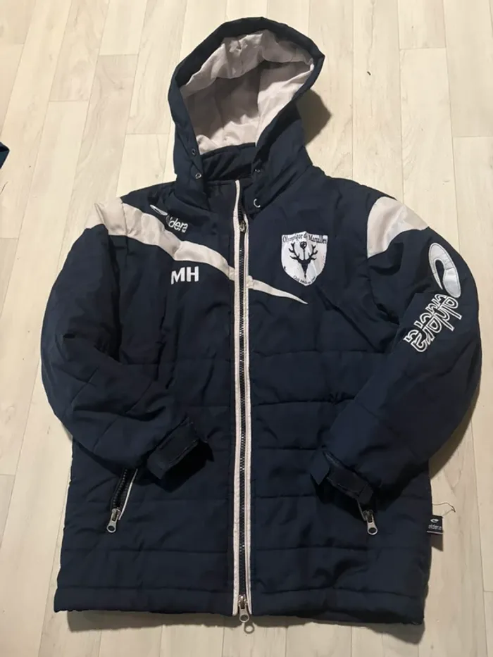 Manteau doudoune eldera 10/12 ans bleu marine et blanc très bon état