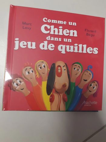 Livre m do Comme un chien dans un jeu de quilles