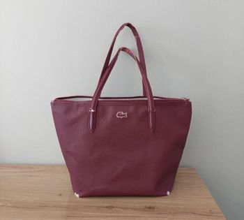 Sac à main lacoste bordeaux usé