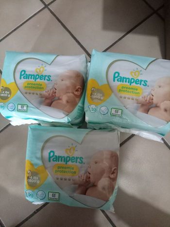 Vends 60 couches pampers t0