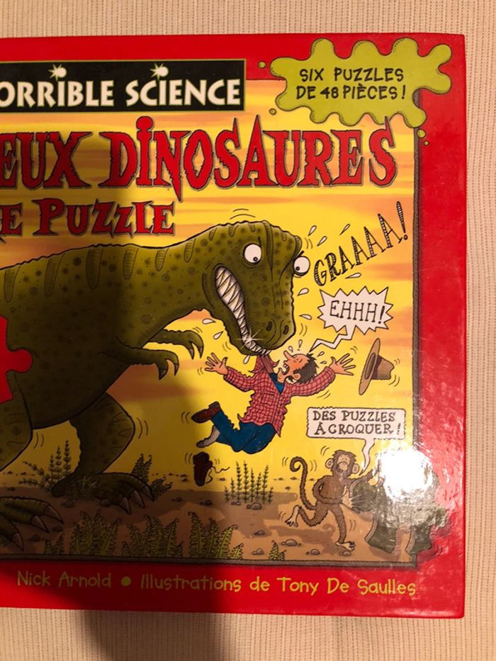 Livre avec plusieurs pages de puzzle dinosaures - photo numéro 3