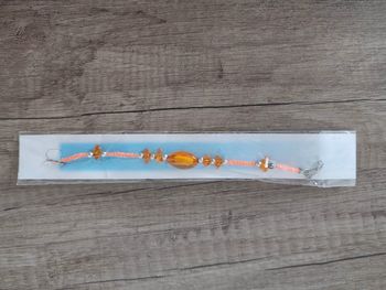 Bracelet fille orange neuf à perles