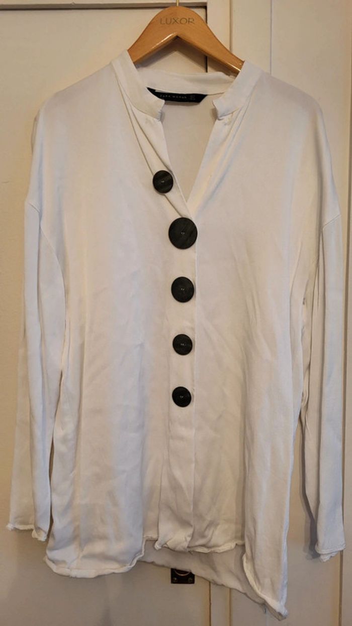 Blouse blanches boutons noirs