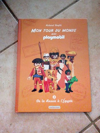 livre "mon tour du monde avec Playmobil" - édition spéciale pour Quick