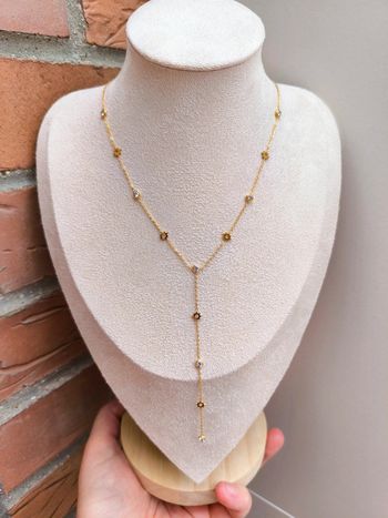 Pendentif doré en Y avec soleil et zircons