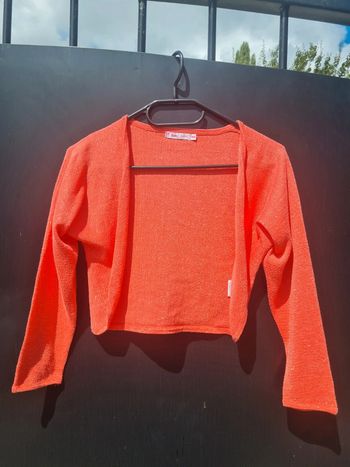 Boléro corail à paillettes Gémo taille 10 ans