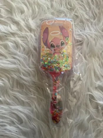 Brosse cheveux stitch neuve
