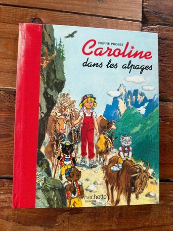 Satisfaisant - Livre édition limitée reliure rouge Caroline dans les Alpages Pierre Probst bd