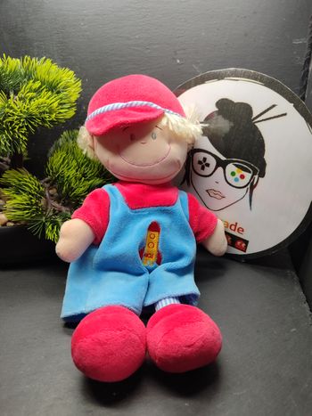 doudou peluche garçon blond salopette bleu rouge fusée ancien casquette Noj Rayé