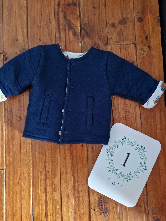 Veste réversible neuve 1 mois