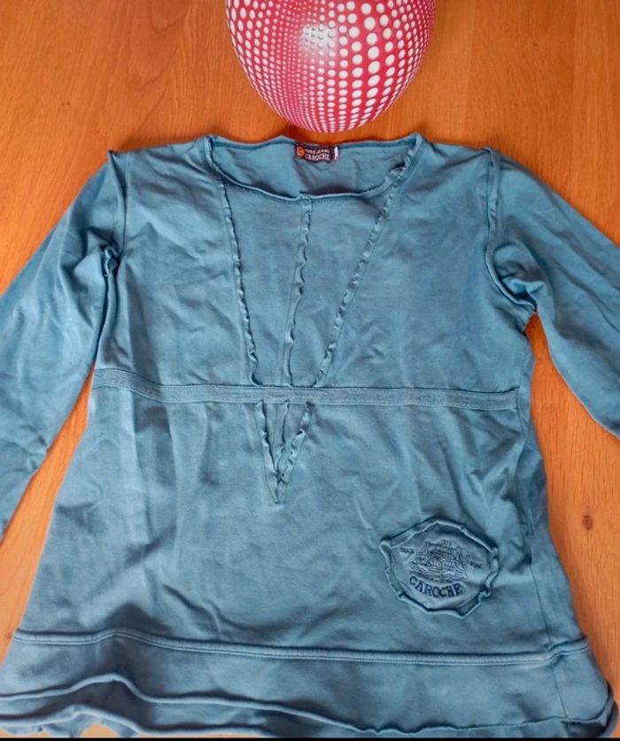Top taille M en très bon état. Couleur bleu canard