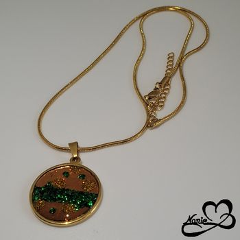 Pendentif doré et vert pailleté
